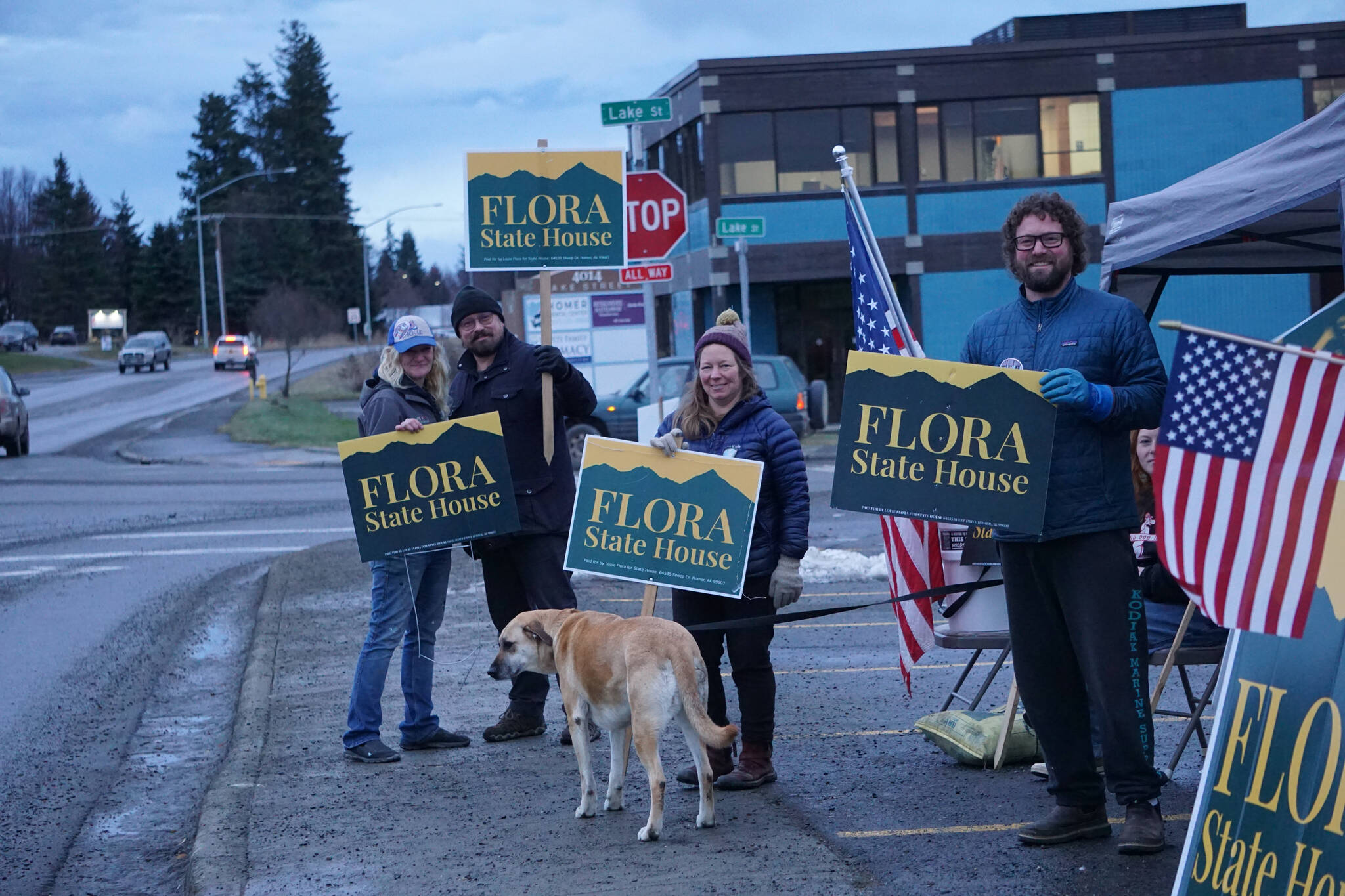 Friends and family of Louie Flora wave signs in support of the candidate for District 6 State House Representative on Tuesday, Nov. 8, 2022, on Pioneer Avenue in Homer, Alaska. From left to right are Chelsea Jones, Jon Flora, Sandy the dog, Sarah Banks and Mikee Flora. Louie Flora’s children Sidney and Rocco are in the tent to the right. (Photo by Michael Armstrong/Homer News)
Friends and family of Louie Flora wave signs in support of the candidate for District 6 State House Representative on Tuesday, Nov. 8, 2022, on Pioneer Avenue in Homer, Alaska. From left to right are Chelsea Jones, Jon Flora, Sandy the dog, Sarah Banks and Mikee Flora. Louie Flora’s children Sidney and Rocco are in the tent to the right. (Photo by Michael Armstrong/Homer News)