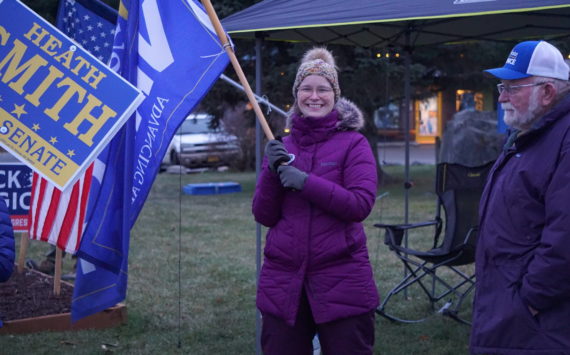 Rep. Sarah Vance, R-Homer, waves a campaign flag on Tuesday, Nov. 8, 2022, at WKFL Park in Homer, Alaska. Vance was part of a group supporting Republican Party candidates including Heath Smith, running for State Senate District C, Kelly Tshibaka, running for U.S. Senate, and Nick Begich III, running for U.S. Congress. (Photo by Michael Armstrong/Homer News)