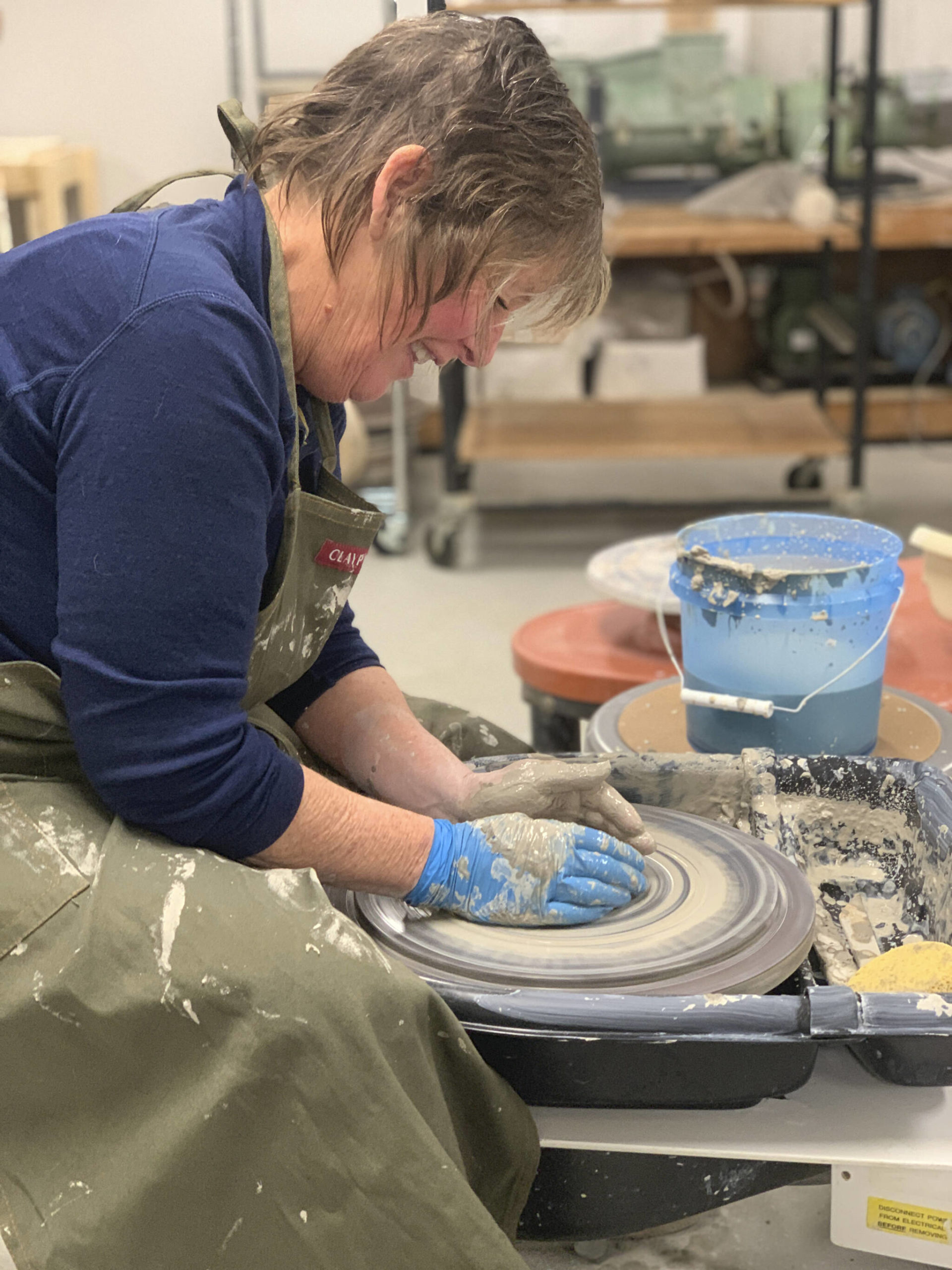 Peggy Paver uses a pottery wheel on Nov. 3, 2022, at the Homer Council on the Art's new ceramics studio in Homer, Alaska. (Photo provided)