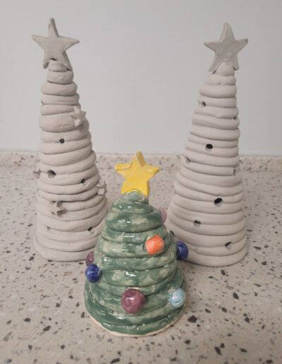 These holiday tree ceramic sculptures are examples of work that will be made in a class to be offered on Dec. 13, 2022, at the new community art space at the Homer Council on the Arts. (Photo provided)
