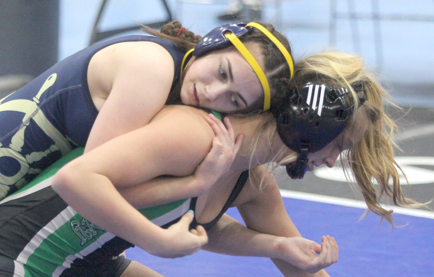 Homer’s Saoirse Cook battles Colony’s Bayleigh Harrington during the girls 126-pound final at the Lancer Smith Memorial wrestling tournament Saturday, Nov. 19, in Wasilla. (Photo by Jeremiah Bartz/Frontiersman)