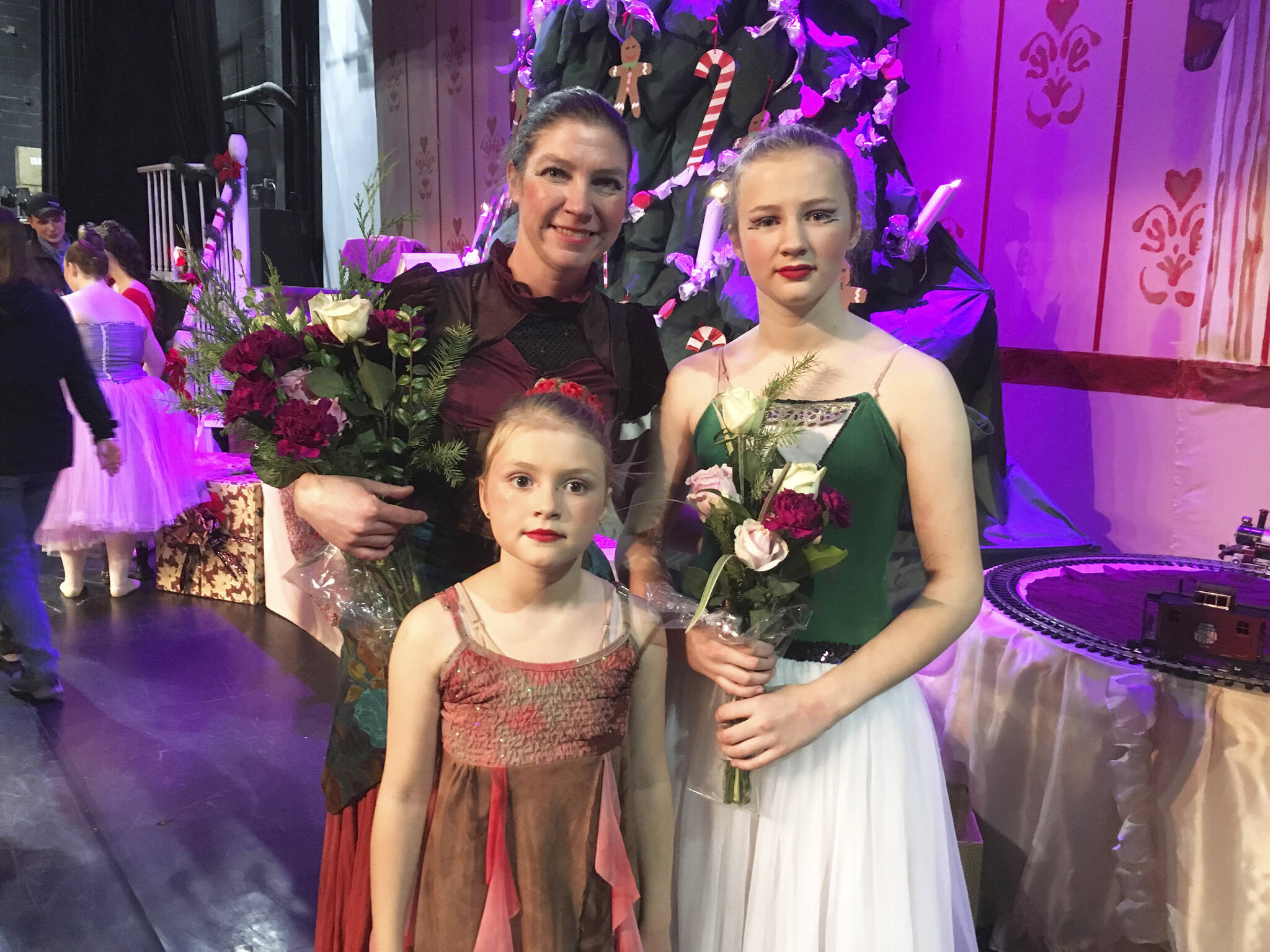 Emilie Springer, left, poses with her daughters, Aurora, bottom left, and Anna, right, after their performance in the 2019 production of the Homer Nutcracker Ballet in Homer, Alaska. (Photo provided)