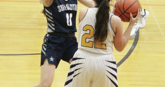 A Soldotna player guards Homer's Hannah Hatfield during a Tuesday, Feb. 25, 2020 basketball game in the Alice Witte Gymnasium in Homer, Alaska. (Photo by Megan Pacer/Homer News)