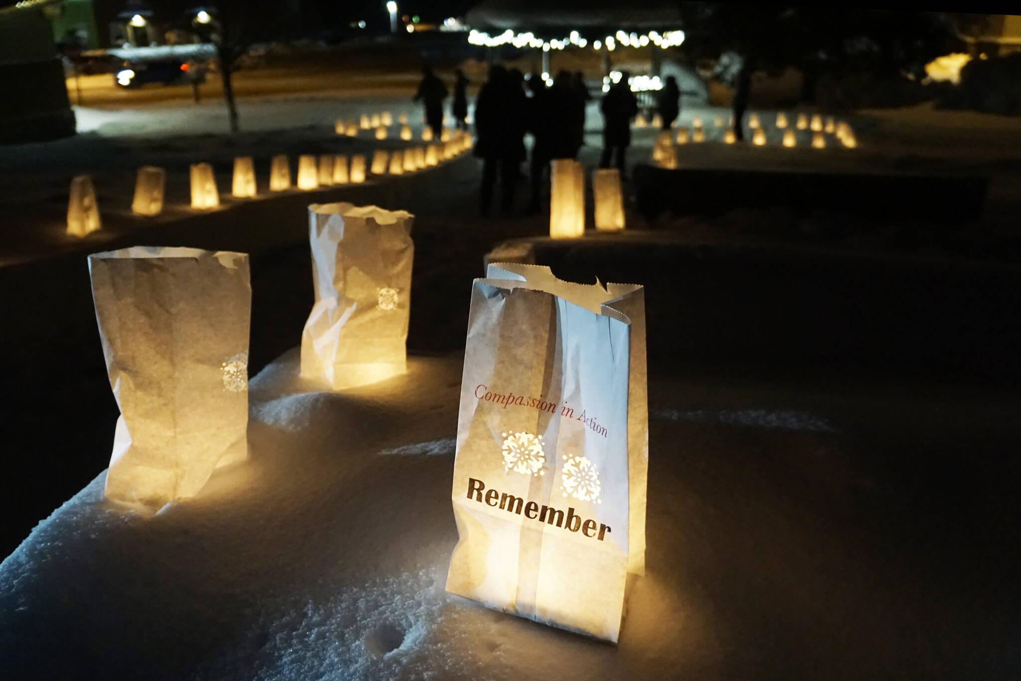 "Remember" is one of the messages on a luminaria onThursday, Dec. 16, 2021, for Hospice of Homer's "LIght Up a Life" event at WKFL Park in Homer, Alaska. (Photo by Michael Armstrong/Homer News)