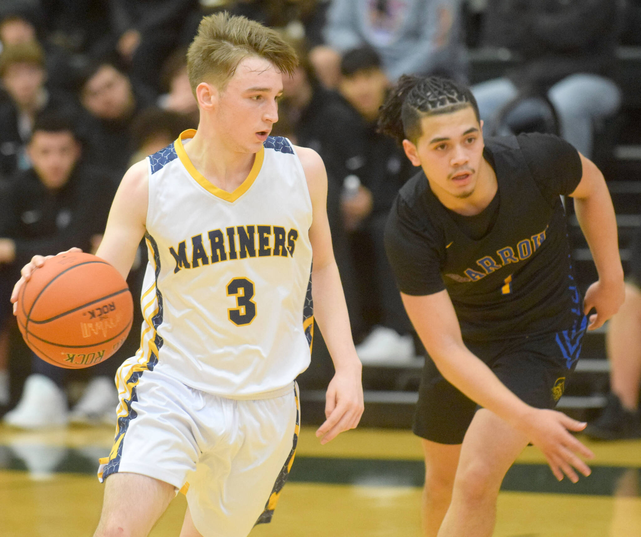 Homer’s Peyton Edens makes a move toward the basket during the Class 3A boys basketball fourth-place semifinals at the Alaska Airlines Center in Anchorage, Alaska, on Thursday, March 24, 2022. (Camille Botello/Peninsula Clarion)