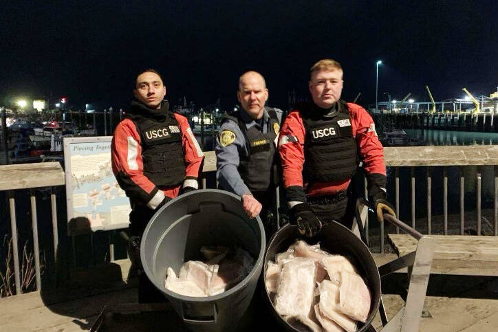 U.S. Coast Guard courtesy photo Two crewmembers from Coast Guard Cutter Naushon and a member from the National Oceanic and Atmospheric Administration Office of Law Enforcement (NOAA OLE) pose for a picture with allegedly illegally-retained halibut in Homer, Alaska, Wednesday, Nov. 30, 2022. While conducting a boarding of a commercial fishing vessel, a Cutter Naushon boarding team member discovered a total of 117 pounds of illegally-retained halibut aboard the vessel and handed them over to NOAA OLE representatives in Homer.