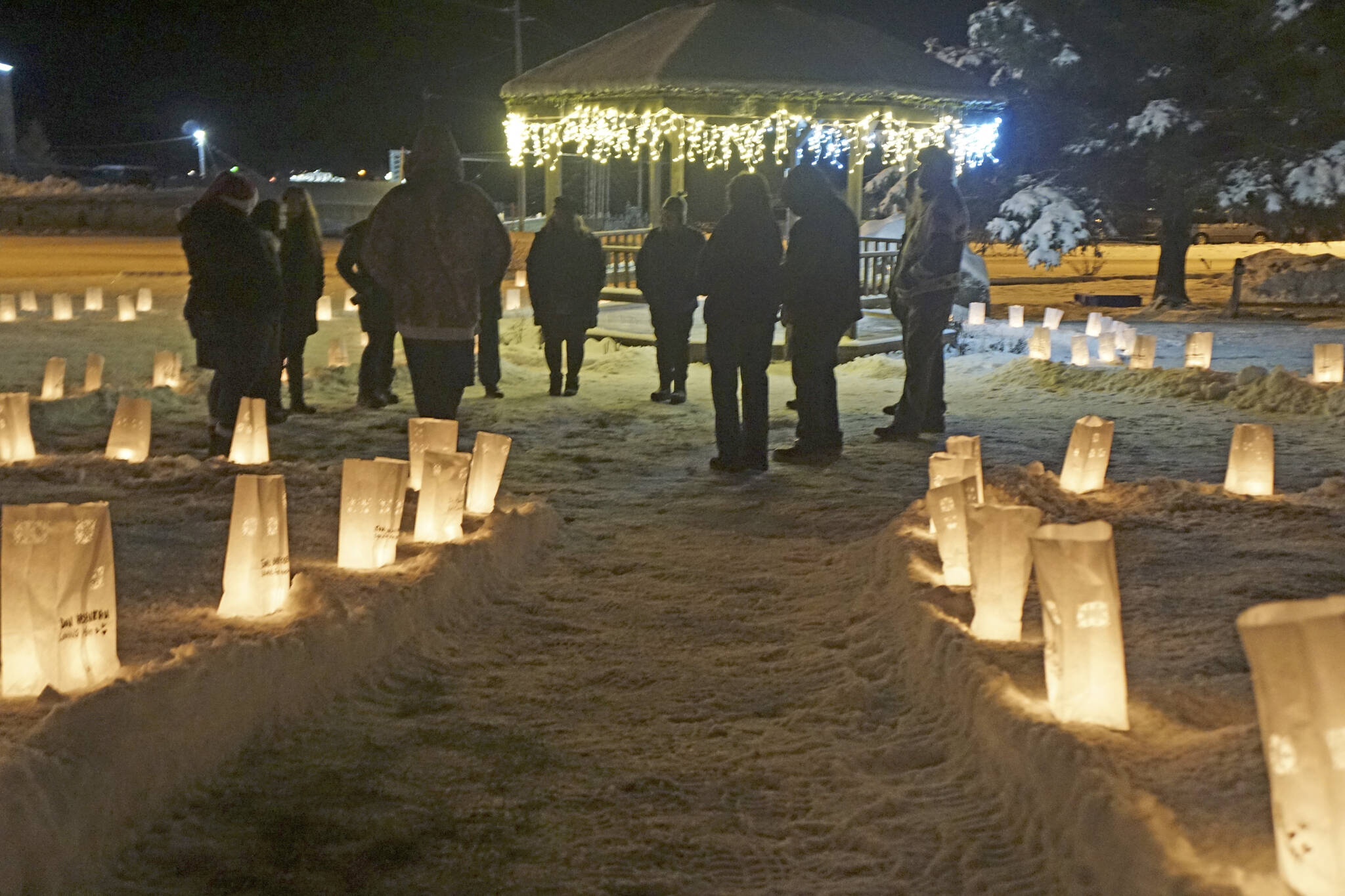 People gather for Light Up a Life on Thursday, Dec. 15, 2022, at WKFL Park in Homer, Alaska. (Photo by Michael Armstrong/Homer News)