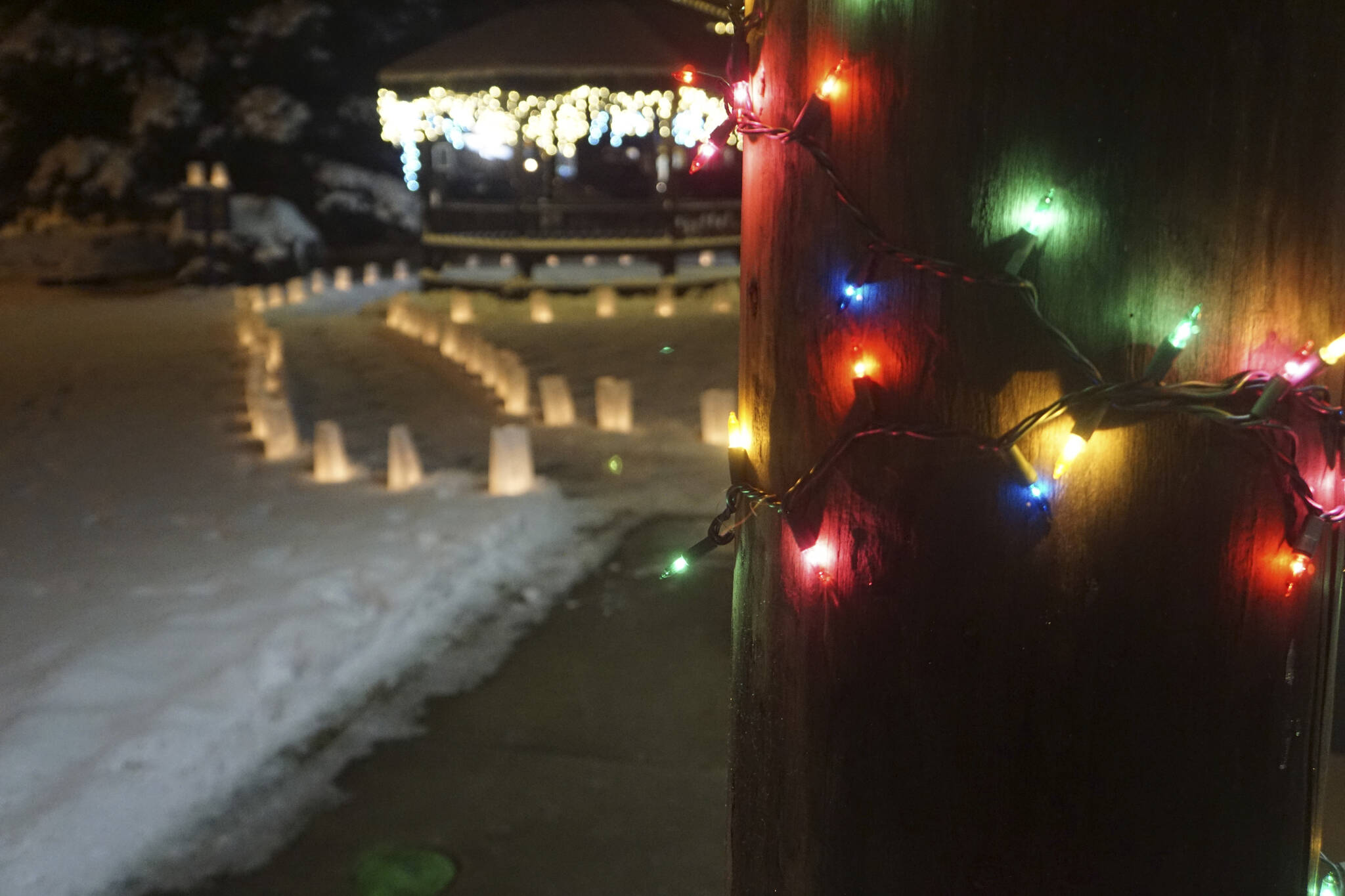 Rows of luminarias line the path at Light Up a Life, a fundraiser for Hospice of Homer, on Thursday, Dec. 15, 2022, at WKFL Park in Homer, Alaska. (Photo by Michael Armstrong/Homer News)