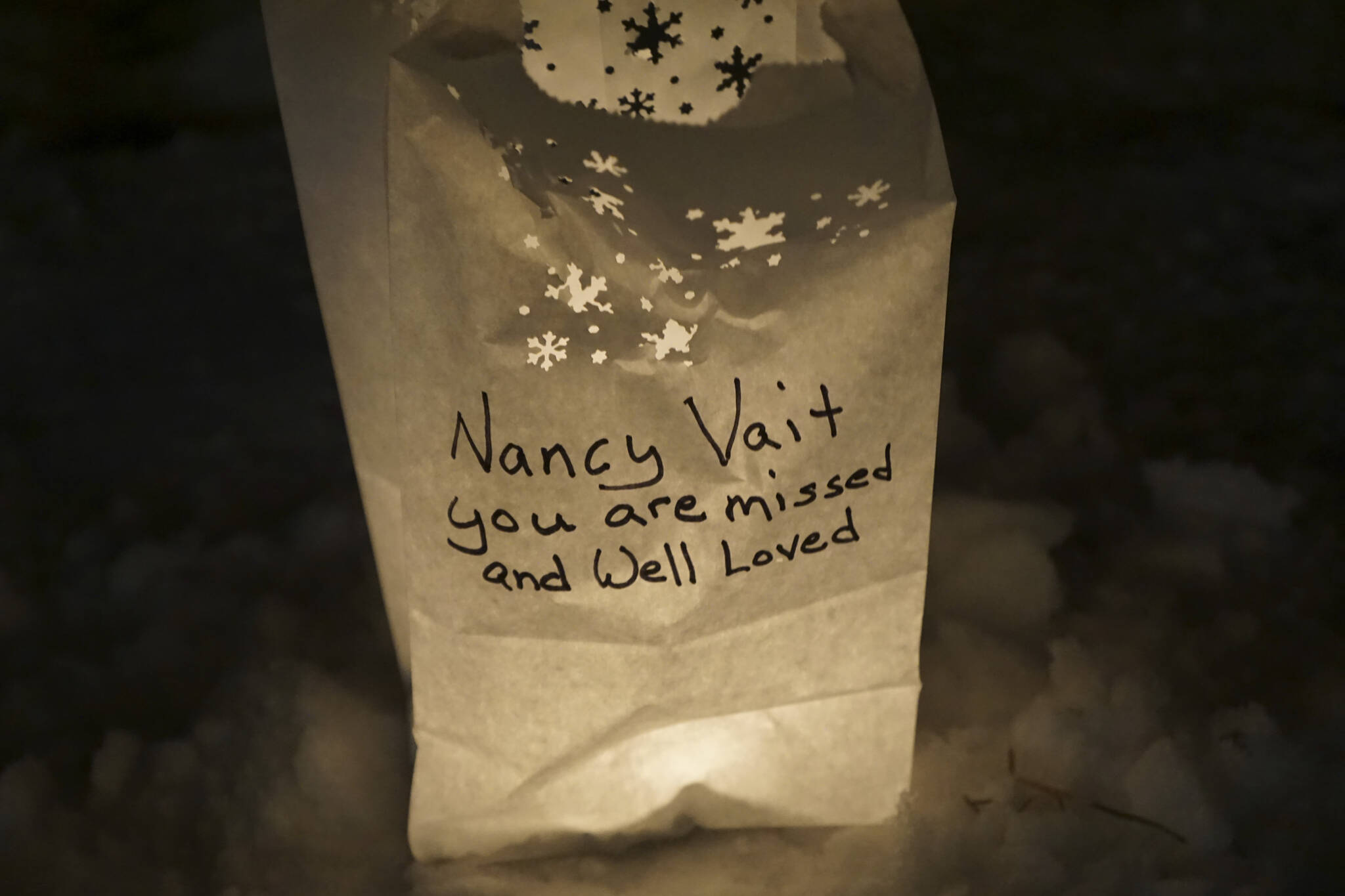 A luminaria in honor of Nancy Vait, who died on Setp. 21, 2022, was one of the lanterns put up at Light Up a Life, a fundraiser for Hospice of Homer, on Thursday, Dec. 15, 2022, at WKFL Park in Homer, Alaska. (Photo by Michael Armstrong/Homer News)