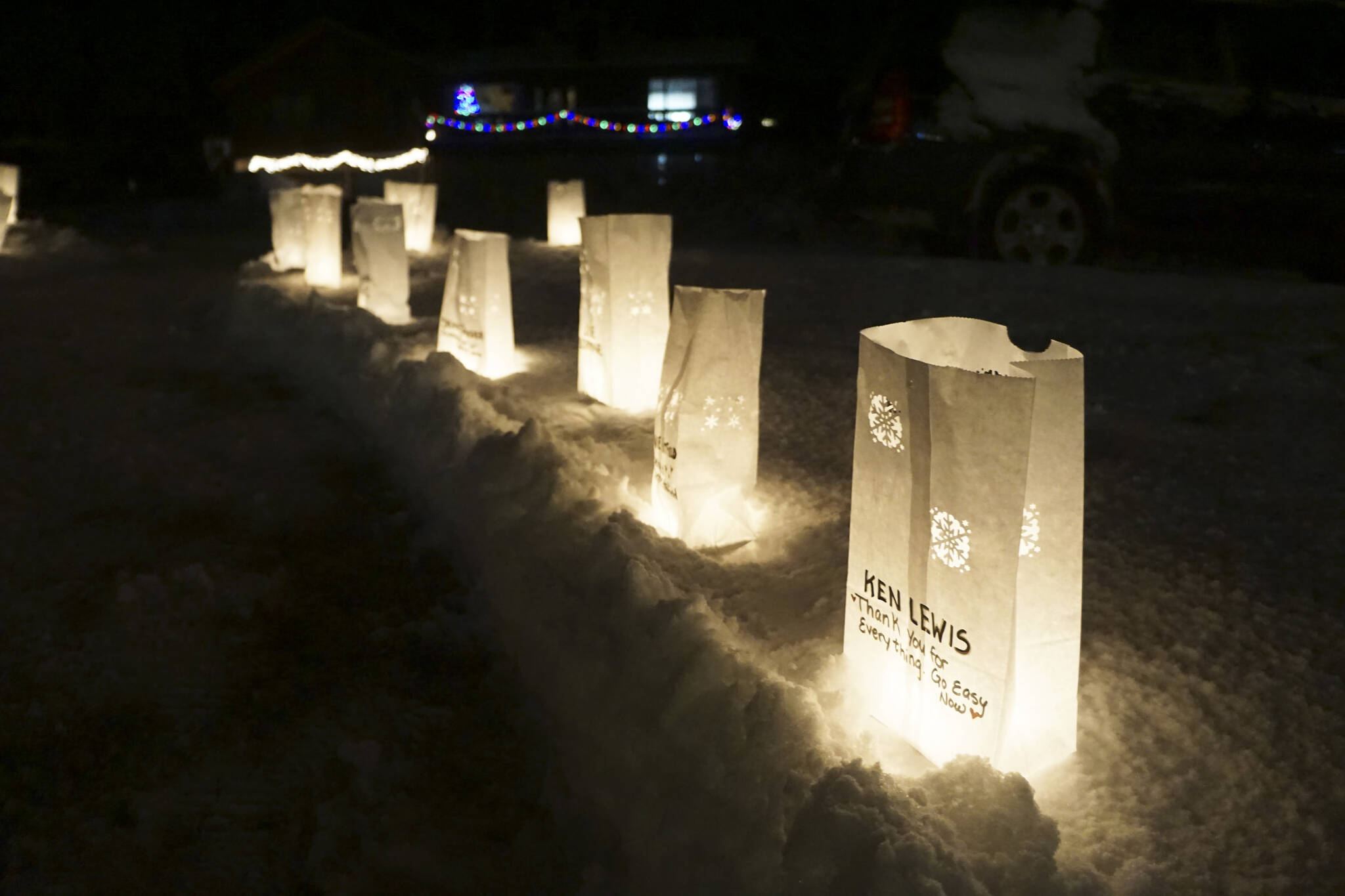 Rows of luminarias line the path at Light Up a Life, a fundraiser for Hospice of Homer, on Thursday, Dec. 15, 2022, at WKFL Park in Homer, Alaska. (Photo by Michael Armstrong/Homer News)