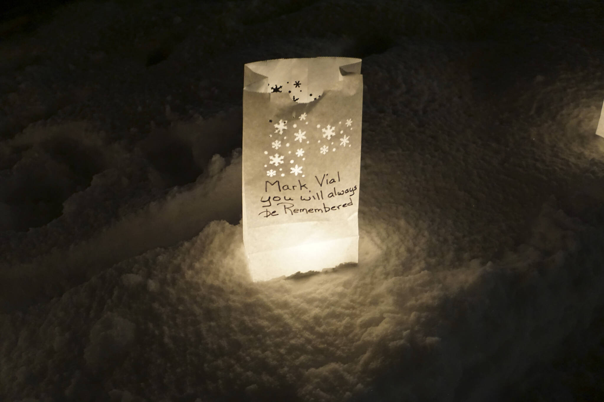 A luminaria in honor of Mark Vial, wo died on June 29, 2022, was one of the lanterns put up at Light Up a Life, a fundraiser for Hospice of Homer, on Thursday, Dec. 15, 2022, at WKFL Park in Homer, Alaska. (Photo by Michael Armstrong/Homer News)
