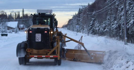 Ashlyn O’Hara/Peninsula Clarion 
A City of Kenai grader moves snow from a roadway on Wednesday, Dec. 7, 2022, in Kenai, Alaska.