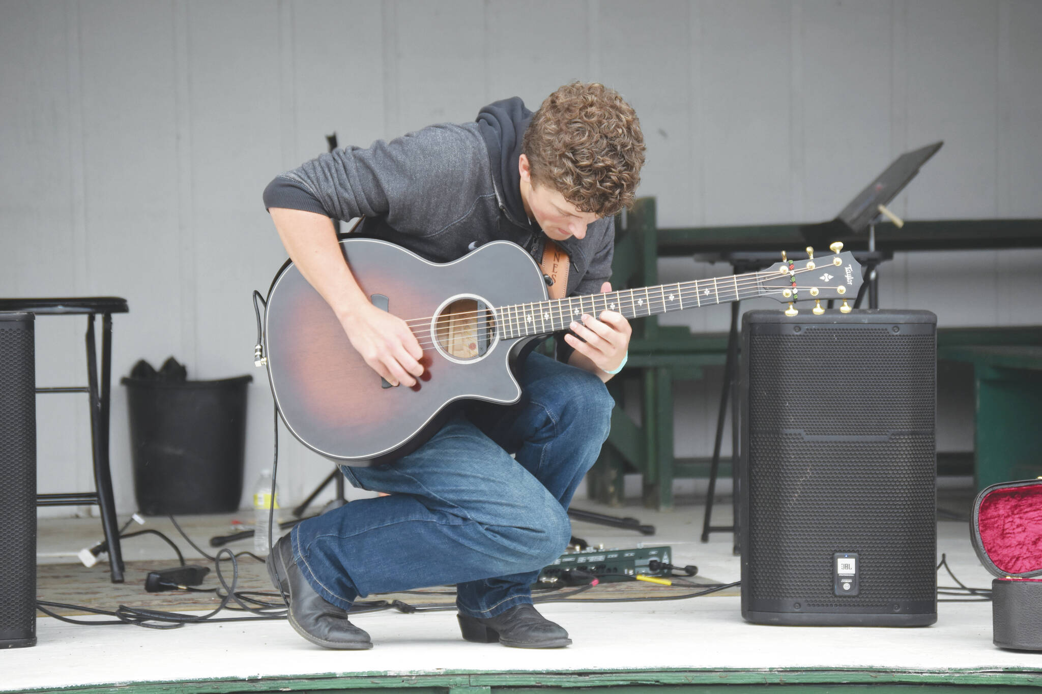 Homer youth Silas Jones performs on the Inlet Stage at the Kenai Peninsula Fair on Aug. 12 , in Ninilchik . (Jake Dye/Peninsula Clarion)