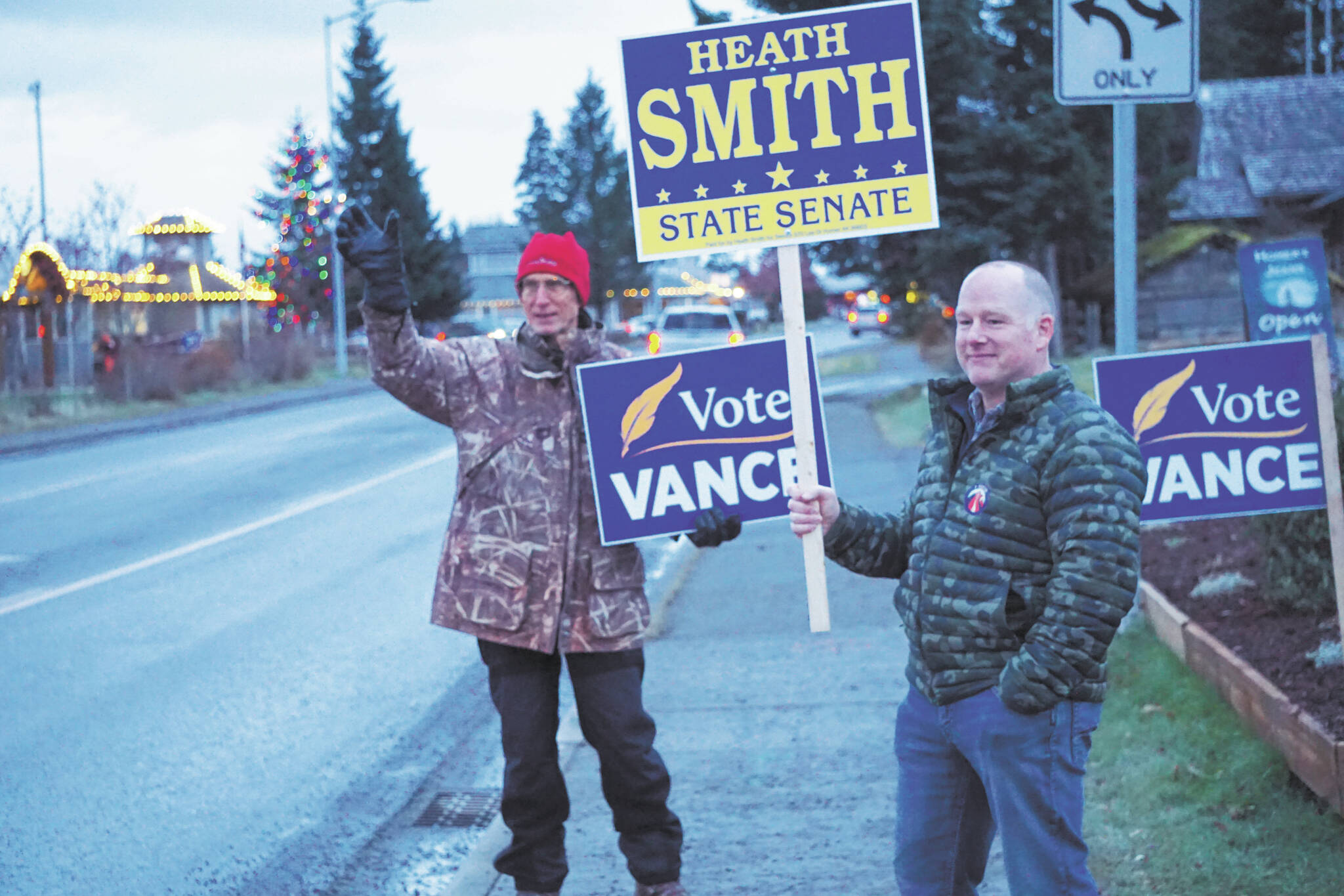 Photo by Michael Armstrong/Homer News 
Heath Smith, right, candidate for State Senate District C, waves signs on Tuesday, Nov. 8 on Pioneer Avenue. At left, Charlie Franz shows his support for Rep. Sarah Vance, running for reelection and for the new District 6.