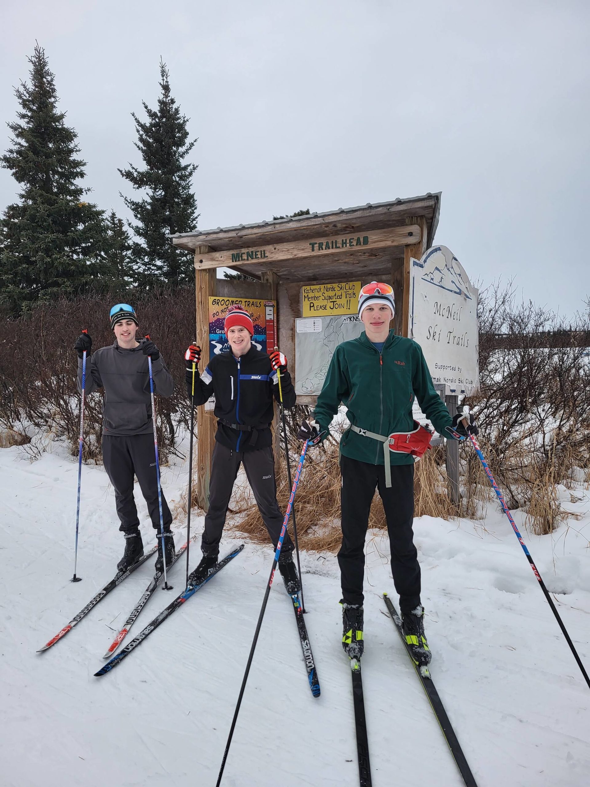 Garrett Briscoe, Jody Goodrich and Ethan Styvar, from left, get set to ski at Baycrest Ski Trail for the Ski Your Age event, Dec. 26, 2022, in Homer, Alaska. (Photo courtesy Jessie Goodrich)