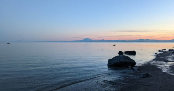 Mount Redoubt can be seen acoss Cook Inlet from North Kenai Beach on Thursday, July 2, 2022. (Peninsula Clarion file)
