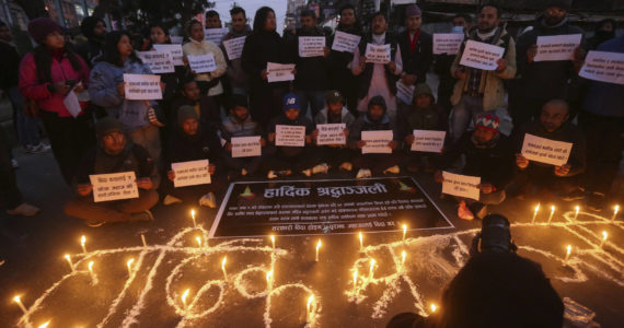 People observe a candlelight vigil in memory of victims of a plane crash in Kathmandu, Nepal, Monday, Jan. 16, 2023. (AP Photo/Bikram Rai)