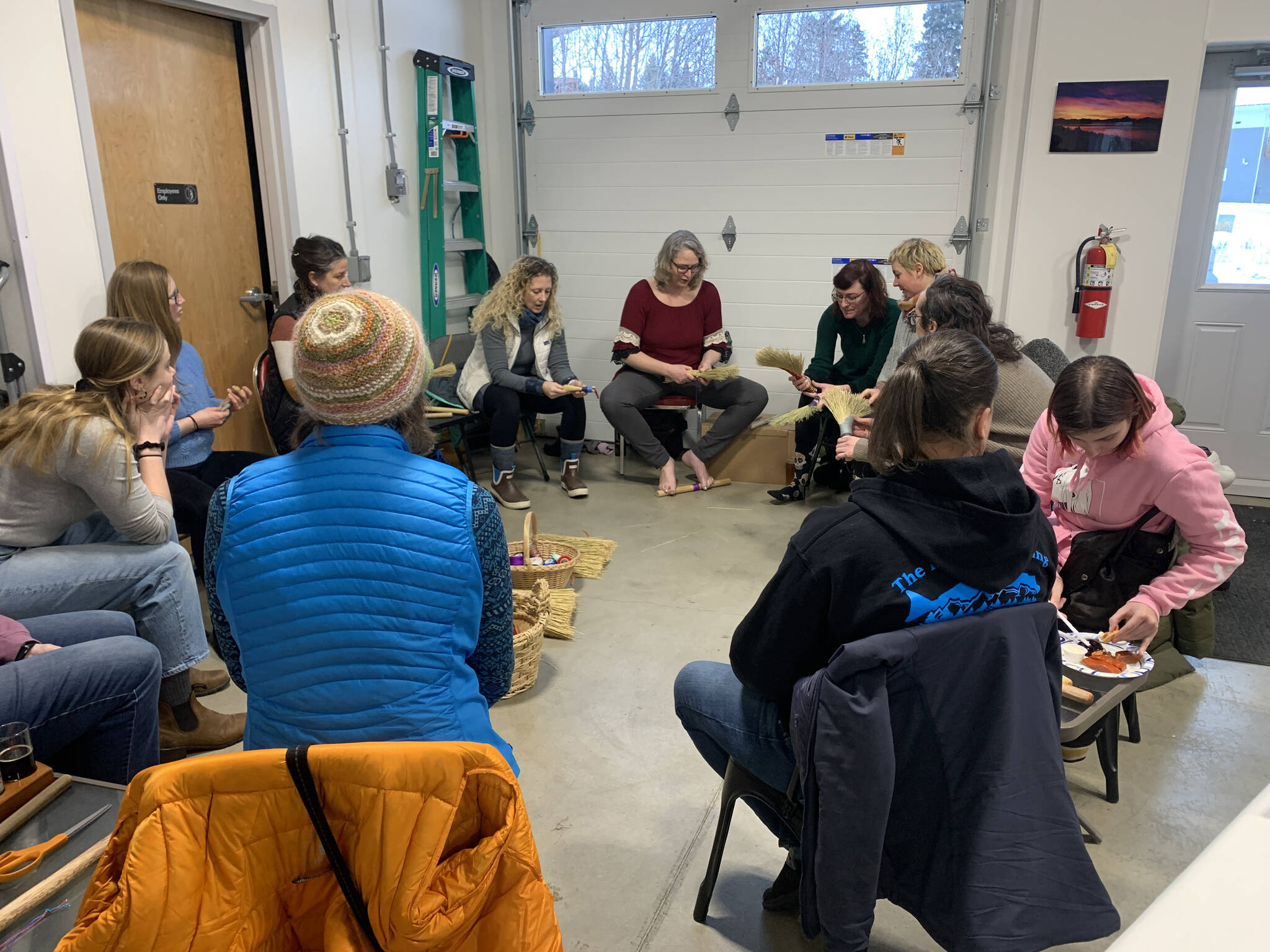 A broom-making workshop at Grace Ridge Brewing with Willow Q Jones, (center), Jan. 22, 2023, in Homer, Alaska. (Photo by Christina Whiting)