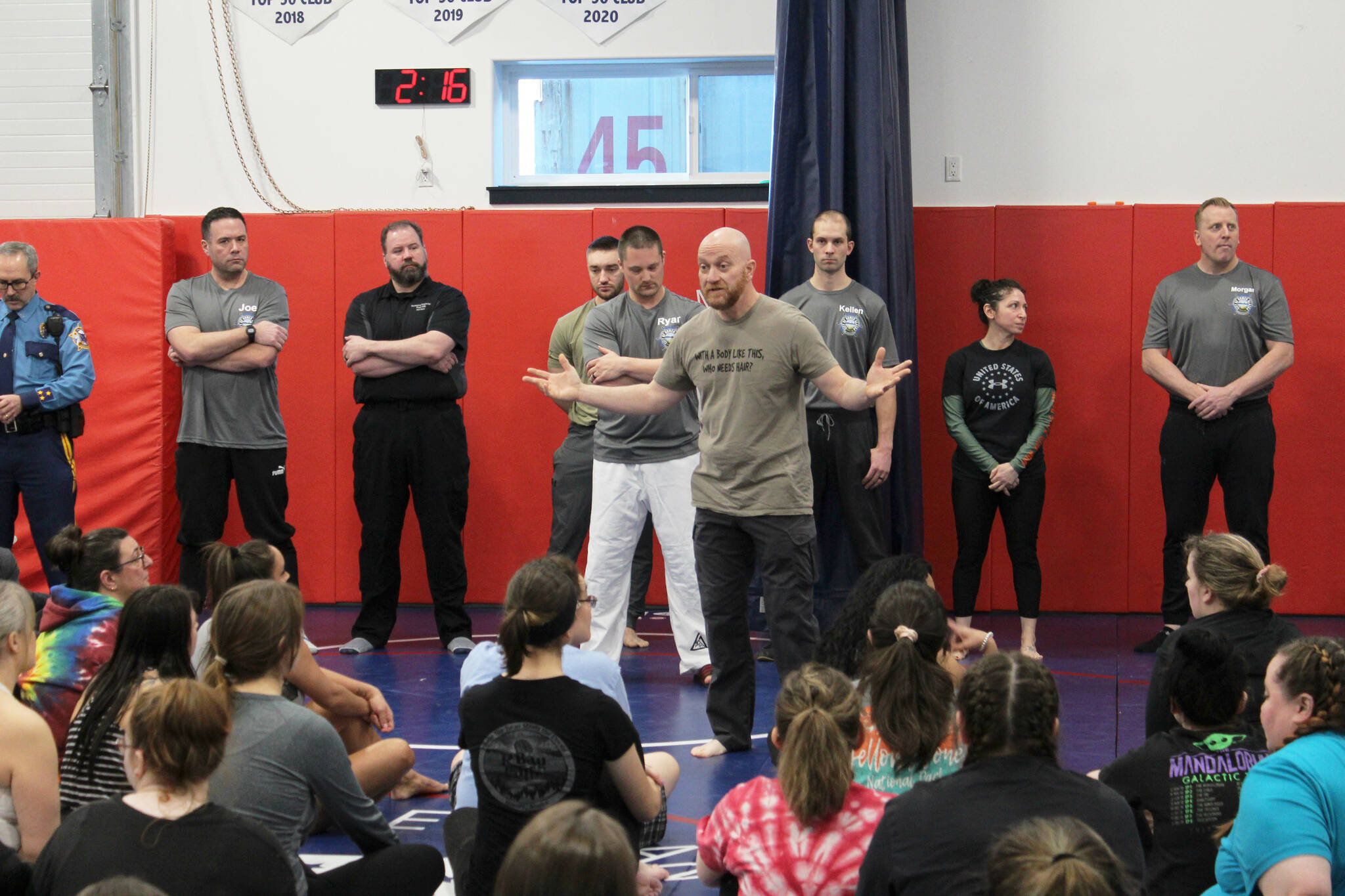 Soldotna Police Chief Gene Meek (center) speaks to attendees during a Toss A Cop event at the All American Training Center on Saturday, Jan. 21, 2023, in Soldotna, Alaska. (Ashlyn OHara/Peninsula Clarion)