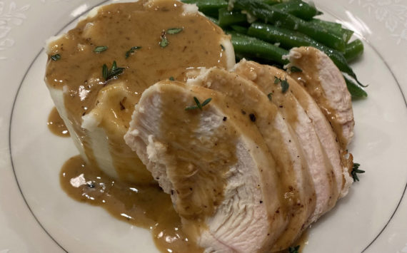 Mashed potatoes are served with chicken breast, green beans and pan sauce. (Photo by Tressa Dale/Peninsula Clarion)