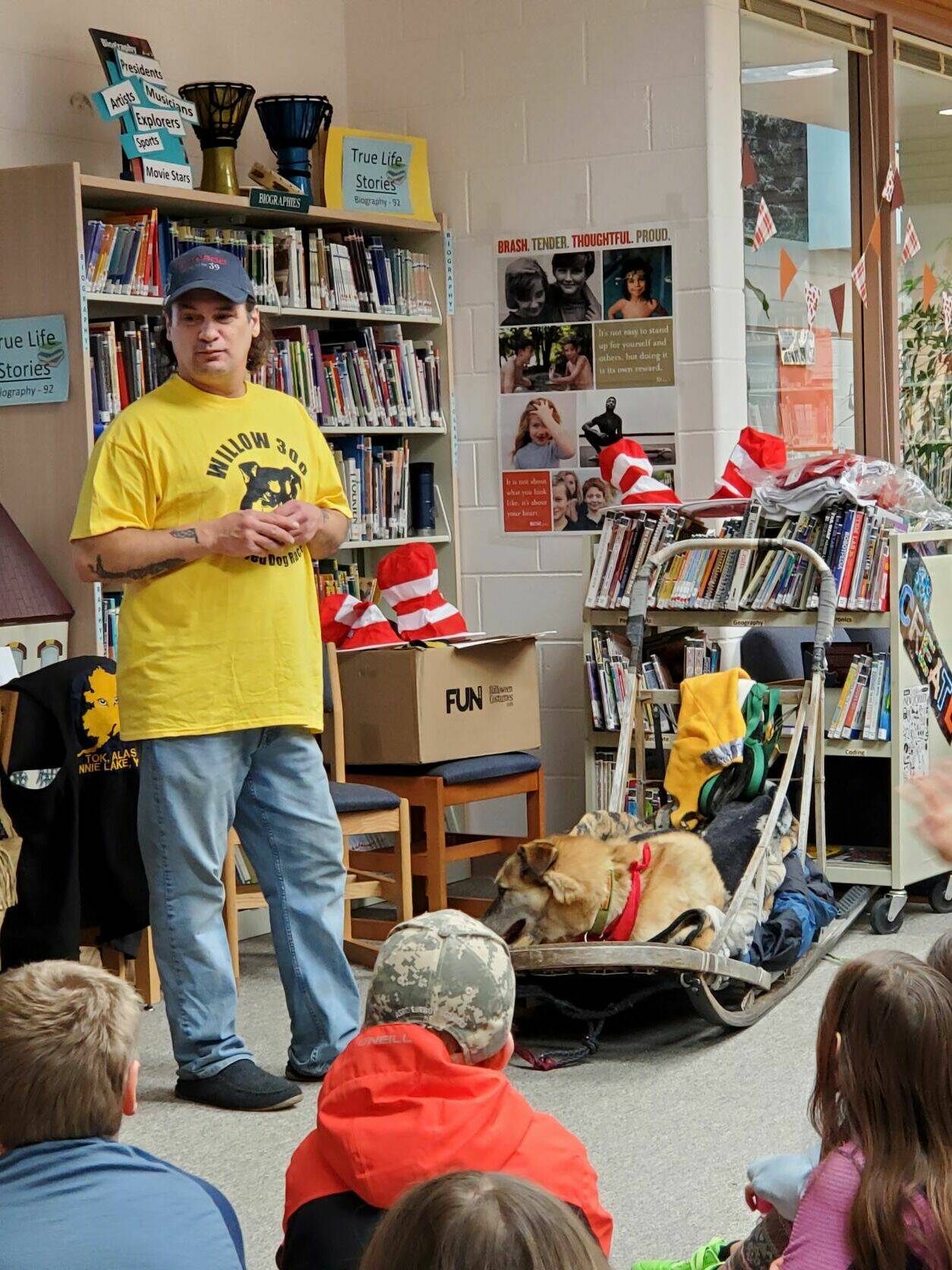 Musher Hugh Neff talks to West Homer Elementary students about reading and dog mushing at a presentation on Friday, Feb. 3 in Homer, Alaska. Photo by Delcenia Cosman
