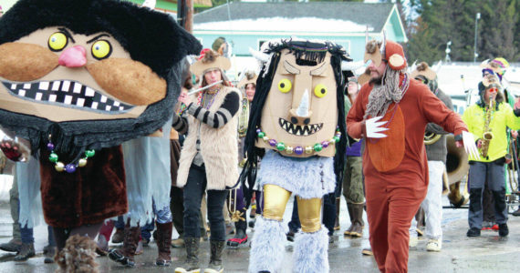 Members of the club Krewe of Gambrinus march in the 2020 Homer Winter Carnival Parade on Pioneer Avenue in Homer, Alaska. They marched dressed as wild things from “Where the Wild Things Are.” (Photo by Megan Pacer/Homer News)