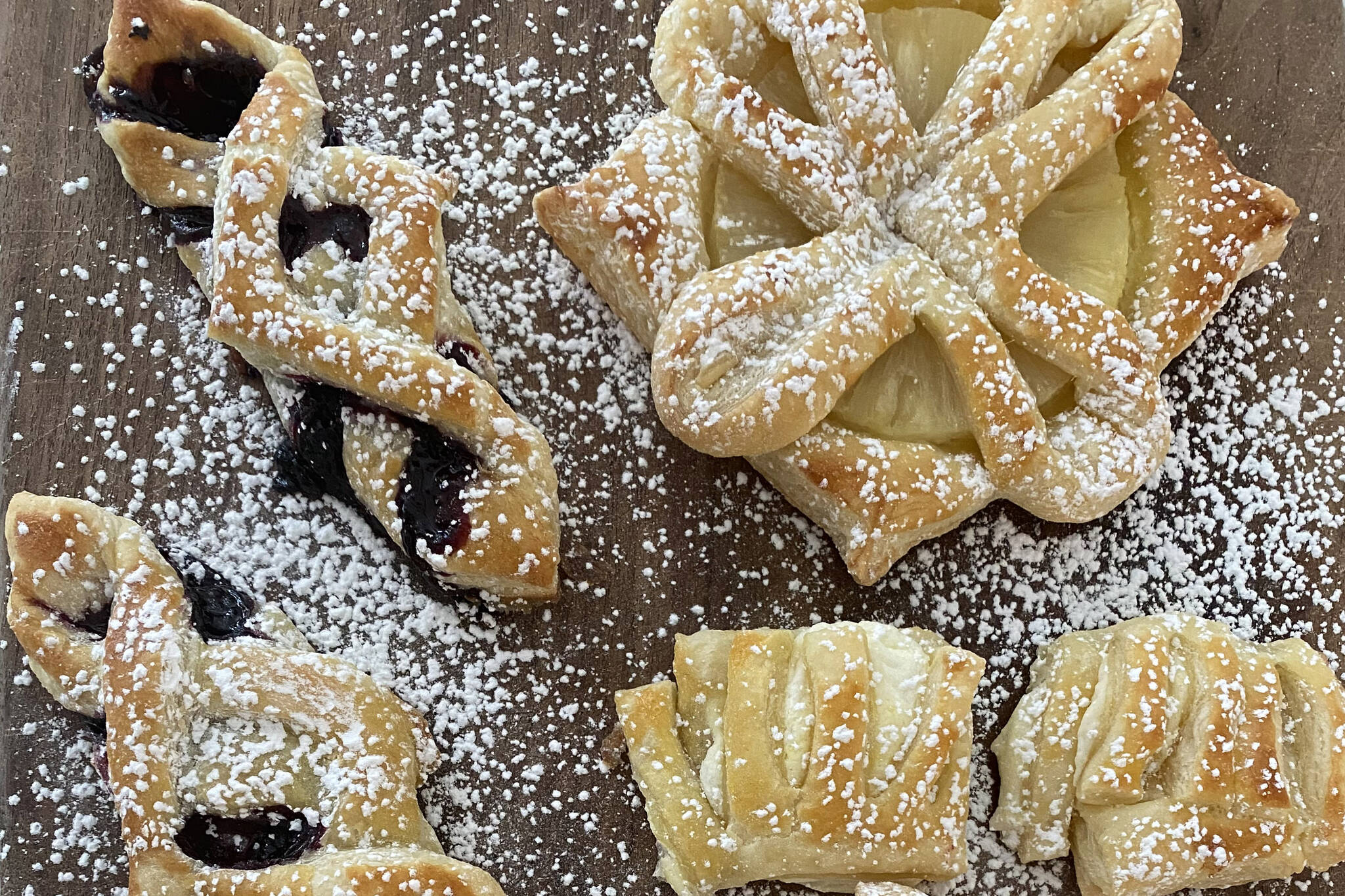 Puff pastry desserts are sprinkled with sugar. (Photo by Tressa Dale/Peninsula Clarion)