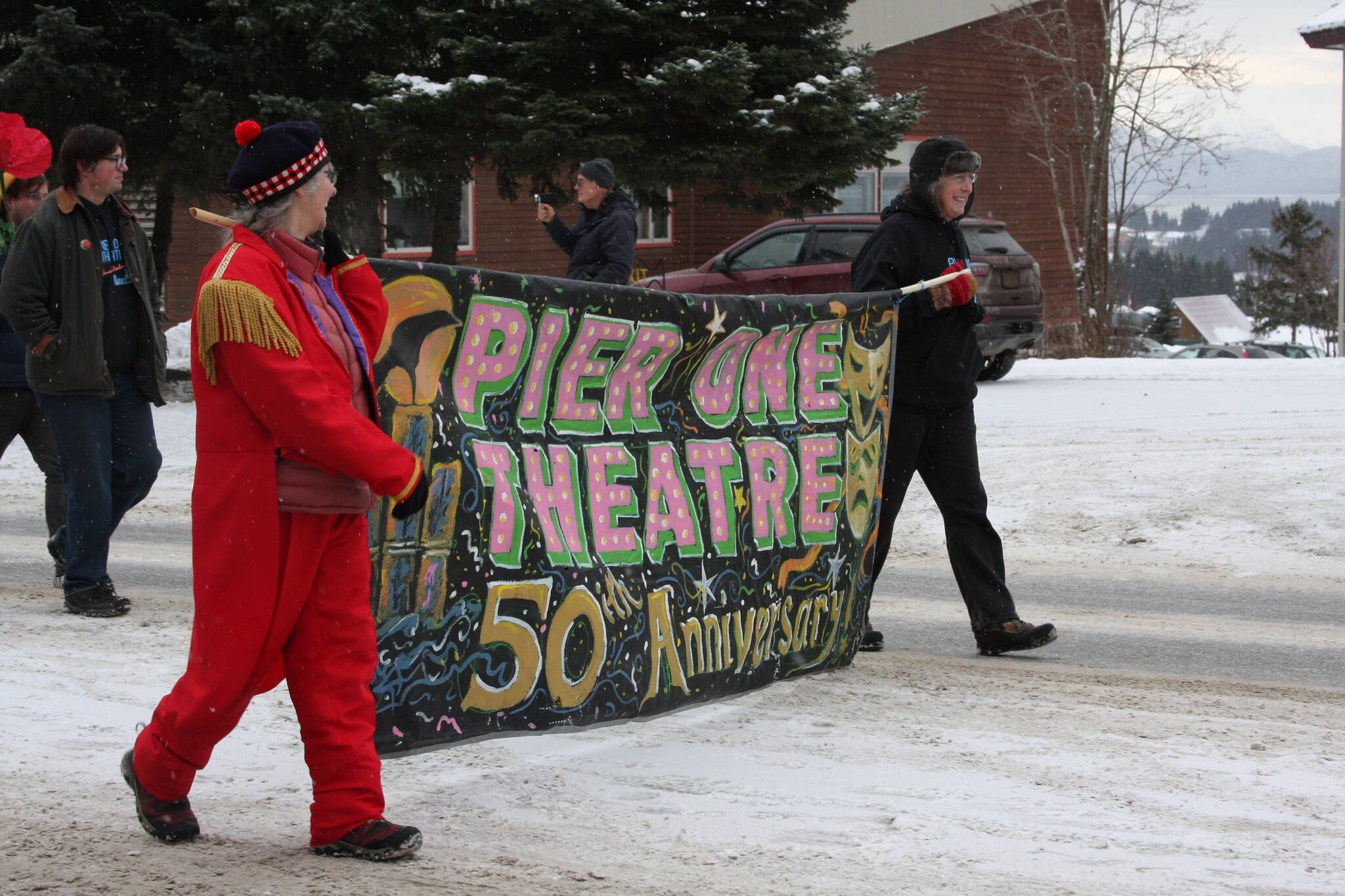 Pier One Theatre members march down Pioneer Avenue in the 69th Annual Winter Carnival Parade on Saturday, Feb. 11, 2023 in Homer, Alaska. Photo by Delcenia Cosman
