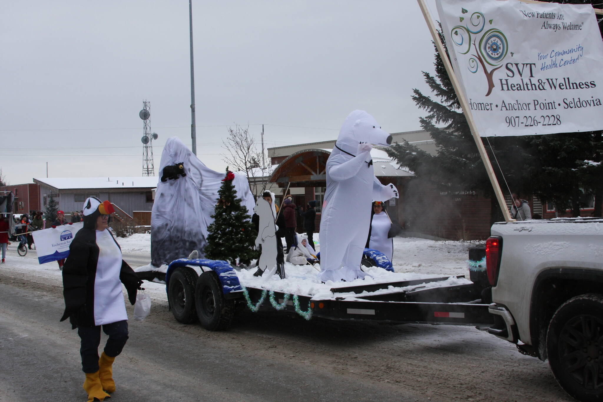 The SVT float makes its way down Pioneer Avenue in the 69th Annual Winter Carnival Parade on Saturday, Feb. 11, 2023 in Homer, Alaska. Photo by Delcenia Cosman