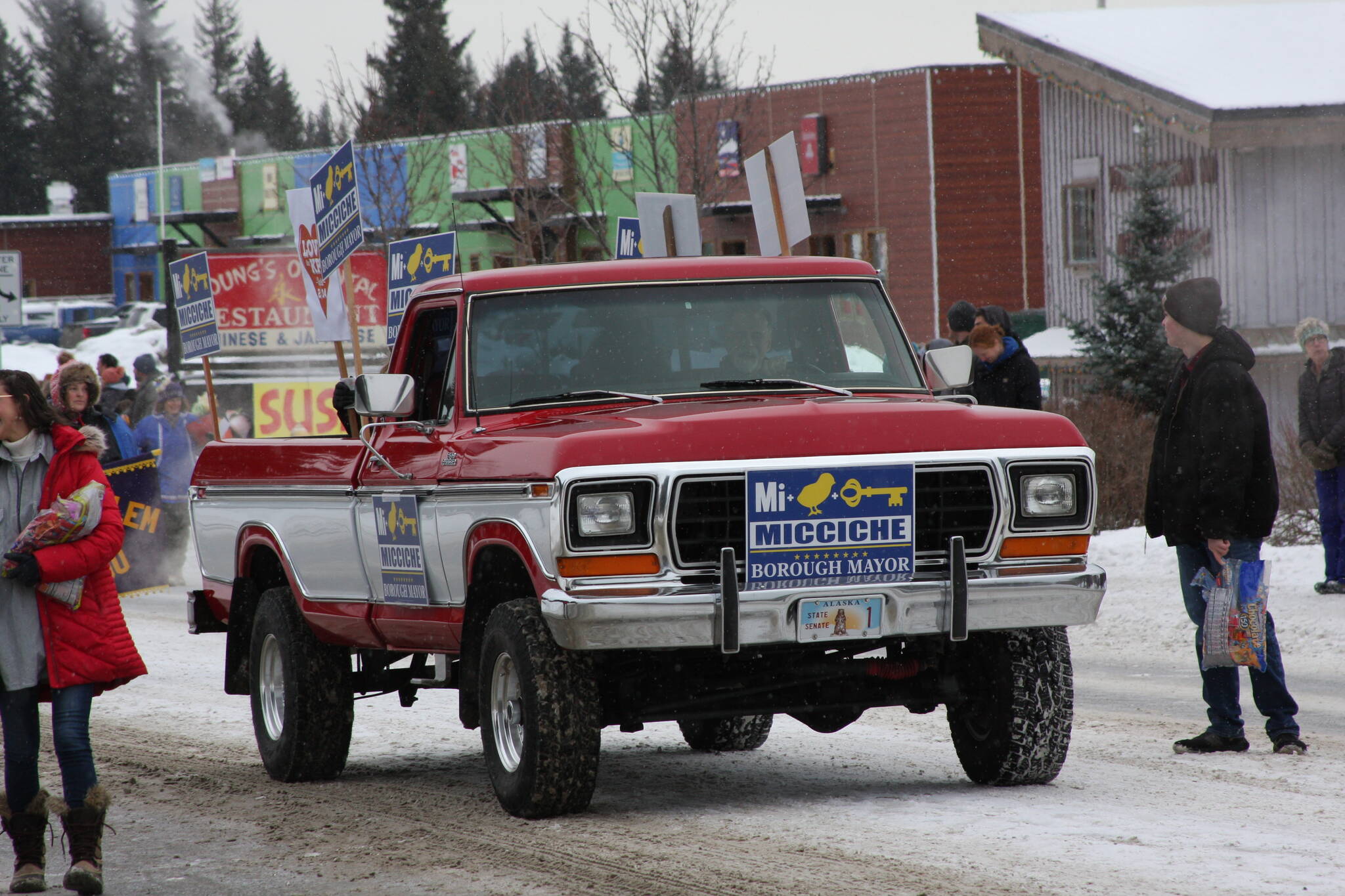 Borough mayoral candidate Peter Micciche drives down Pioneer Avenue in the 69th annual Winter Carnival Parade on Saturday, Feb. 11, 2023 in Homer, Alaska. Photo by Delcenia Cosman