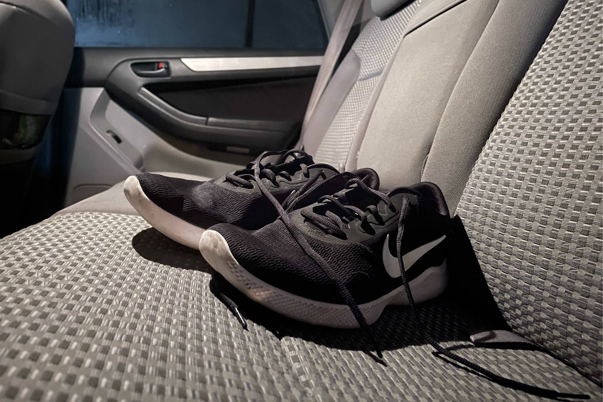 A pair of nearly pristine three-year-old workout shoes are placed in the backseat of Jake Dye’s mostly invincible car in Soldotna, Alaska, on Wednesday, Feb. 8. (Jake Dye/Peninsula Clarion)