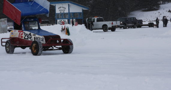 A driver with the Homer Racing Association circles around a plowed track on the frozen Beluga Lake in Homer, Alaska on Saturday, Feb. 11, 2023. Photo by Delcenia Cosman