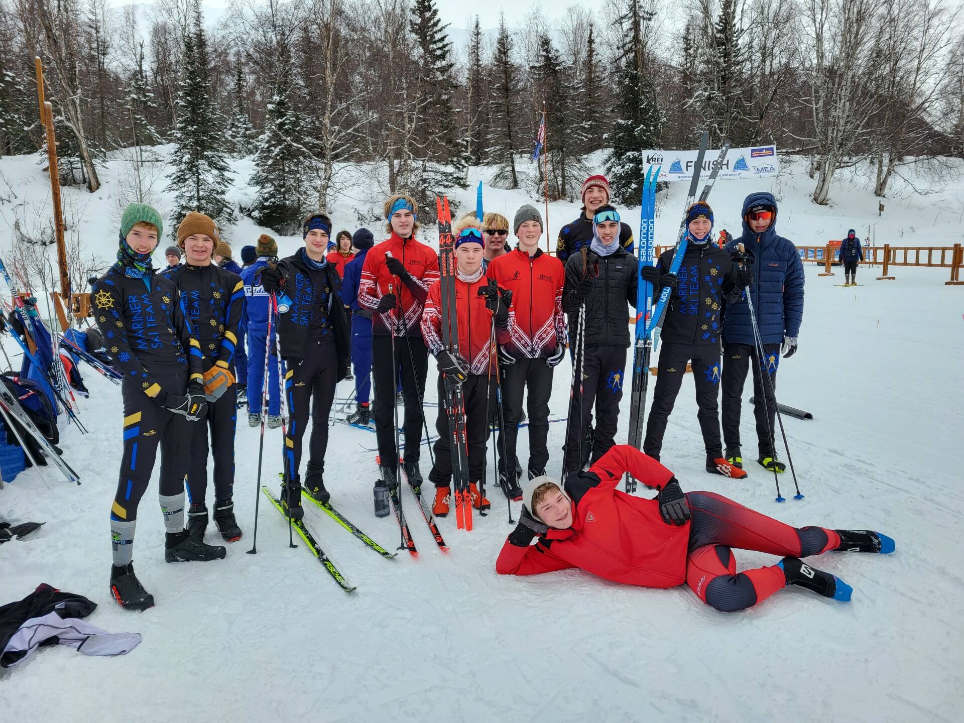 Skiers representing Homer, Kenai and Soldotna cross-country teams pose during the Region 3 cross-country ski meet on Saturday, at the Government Peak Recreation Area in the Matanuska-Susitna valleys. The Homer Mariner XC ski team did well, coach Jessie Goodrich said, noting that when the skiers head to the state competition they have “the potential to be the winning team.”