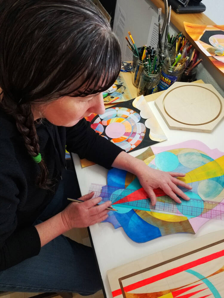 Counsel Langley works on a painting summer 2022 in her Homer home studio. Photo provided by Counsel Langley/courtesy)