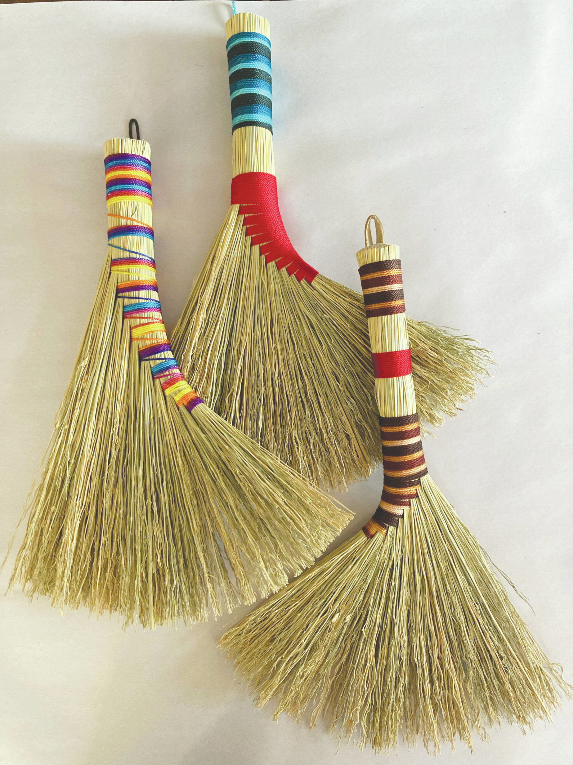 Handmade turkey wing and turkey tail style brooms made by Willow Q Jones in her home studio, January 2023. (Photo provided by Willow Q Jones/courtesy)