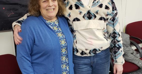 Colleen James, left, poses with her daughter, Jessie James, RN, right at Homer Medical Center, during her retirement party at South Peninsula Hospital on Monday, Feb. 20, 2023. Photo provided by Derotha Ferraro.