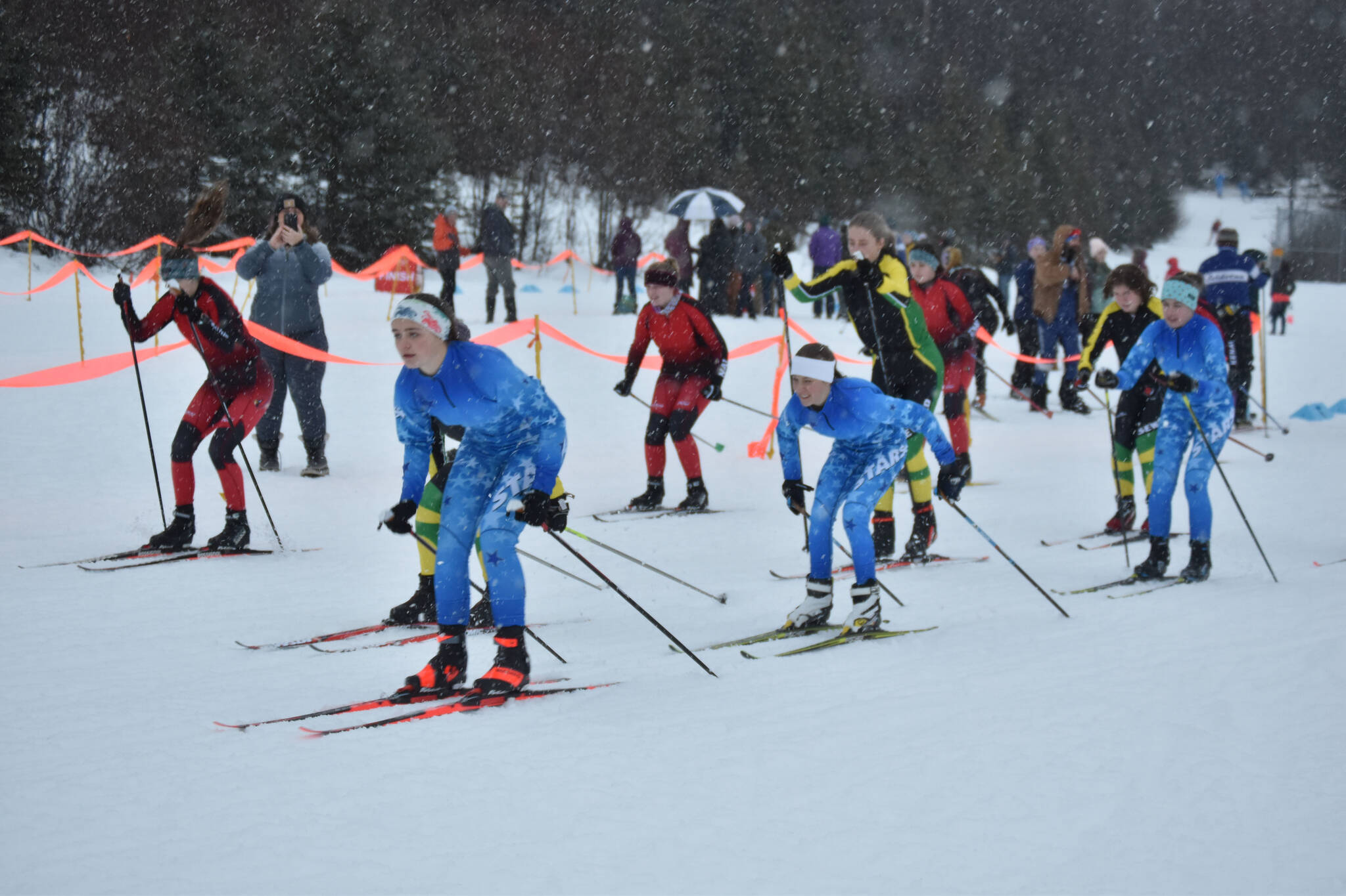 Skiiers from Kenai, Seward and Soldotna start the girls race during the Turkey Trot on Tuesday, Nov. 22, 2022, at Tsalteshi Trails in Soldotna, Alaska.