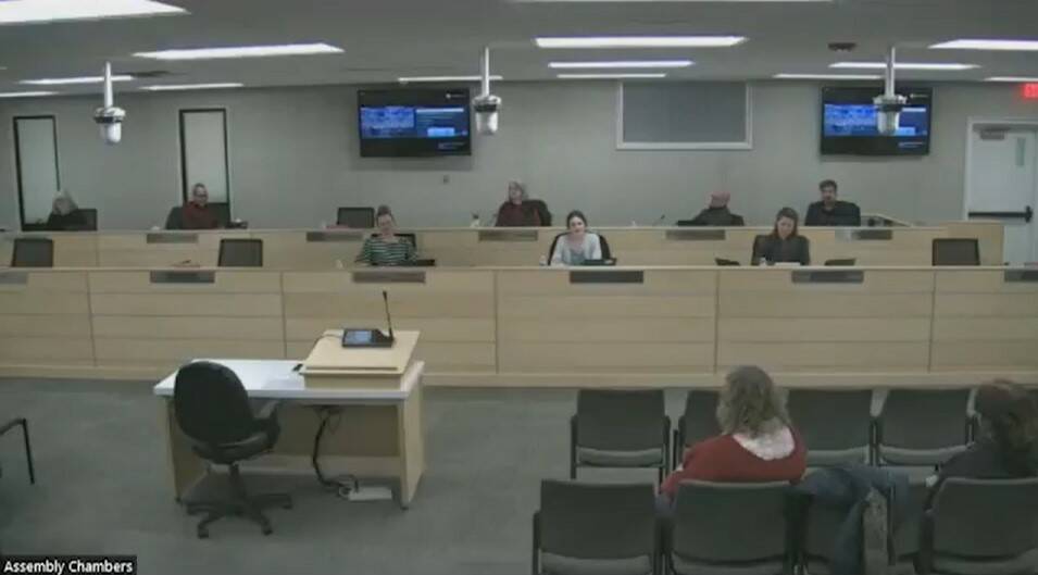 The KPBSD Board of Education listens to Homer High School student body secretary Cecilia Fitzpatrick present their resolution over Zoom on Homer High’s dress code disallowing Salty Dawg apparel in school at the regular meeting on Monday, Feb. 6, 2023 in Soldotna, Alaska. (Photo by Delcenia Cosman/screenshot)