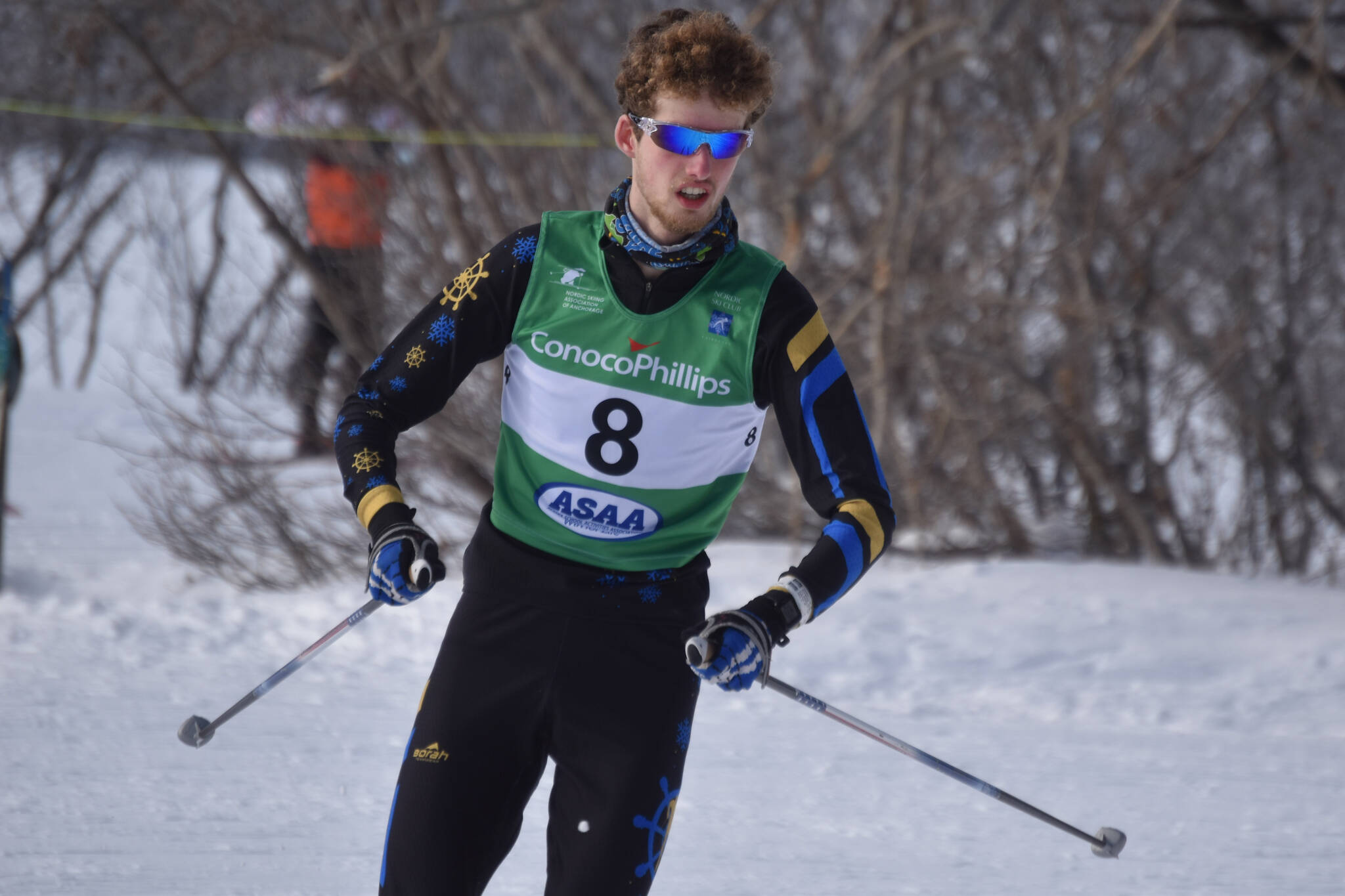 Seamus McDonough, of Homer, rounds a bend during the boys 4x5-kilometer relay at the ASAA State Nordic Ski Championships at Kincaid Park in Anchorage, Alaska, on Saturday, Feb. 25, 2023.
