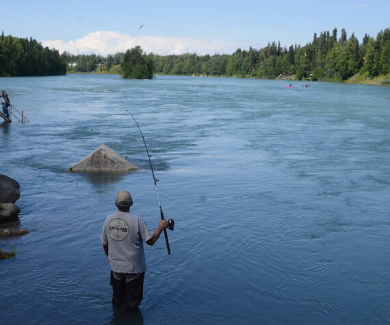 A man fishes in the Kenai River on July 16, 2018, in Soldotna, Alaska. (Peninsula Clarion/file)