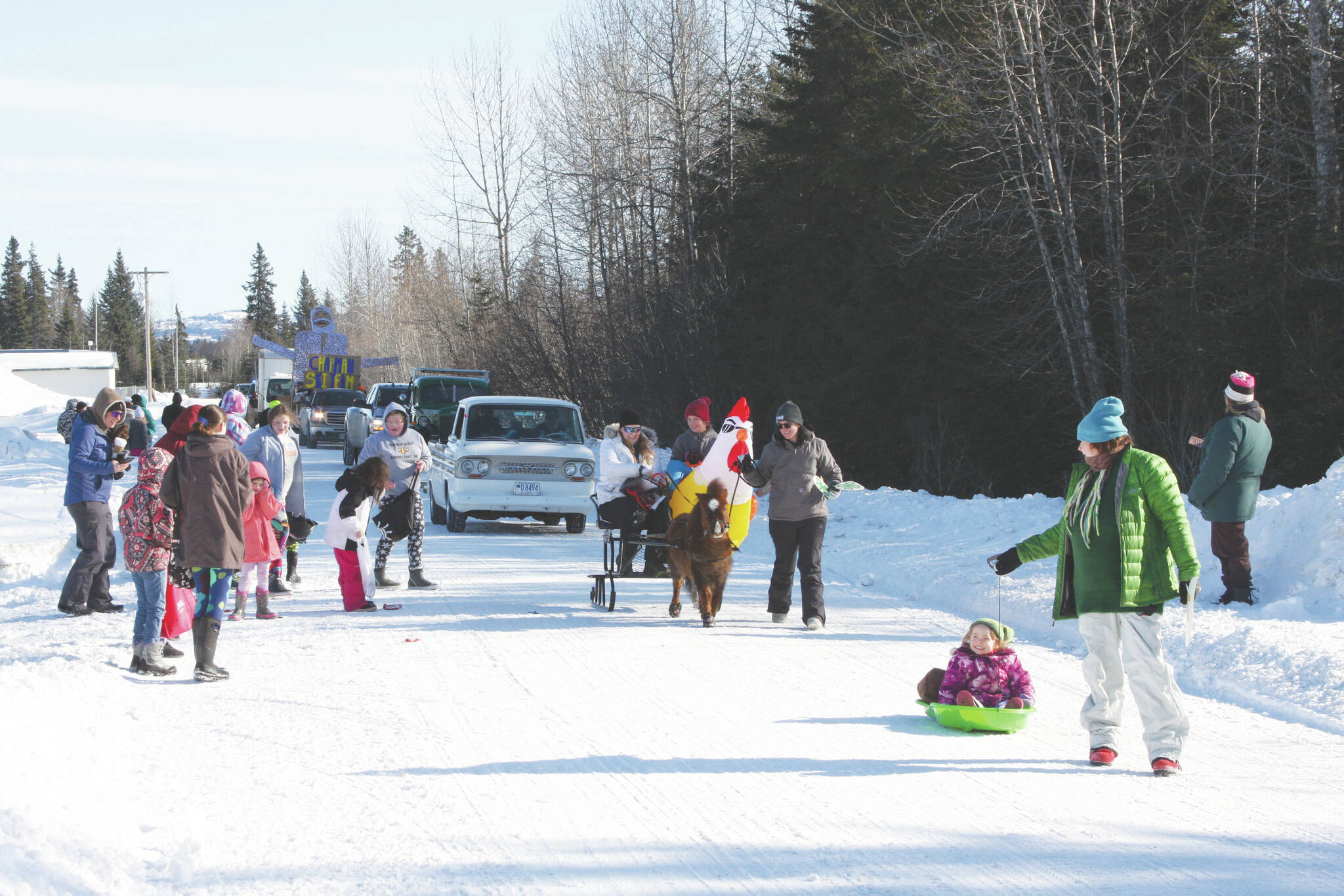The Anchor Point Snow Rondi Parade proceeds down School Street on Saturday in Anchor Point. (Photo by Delcenia Cosman/Homer News)