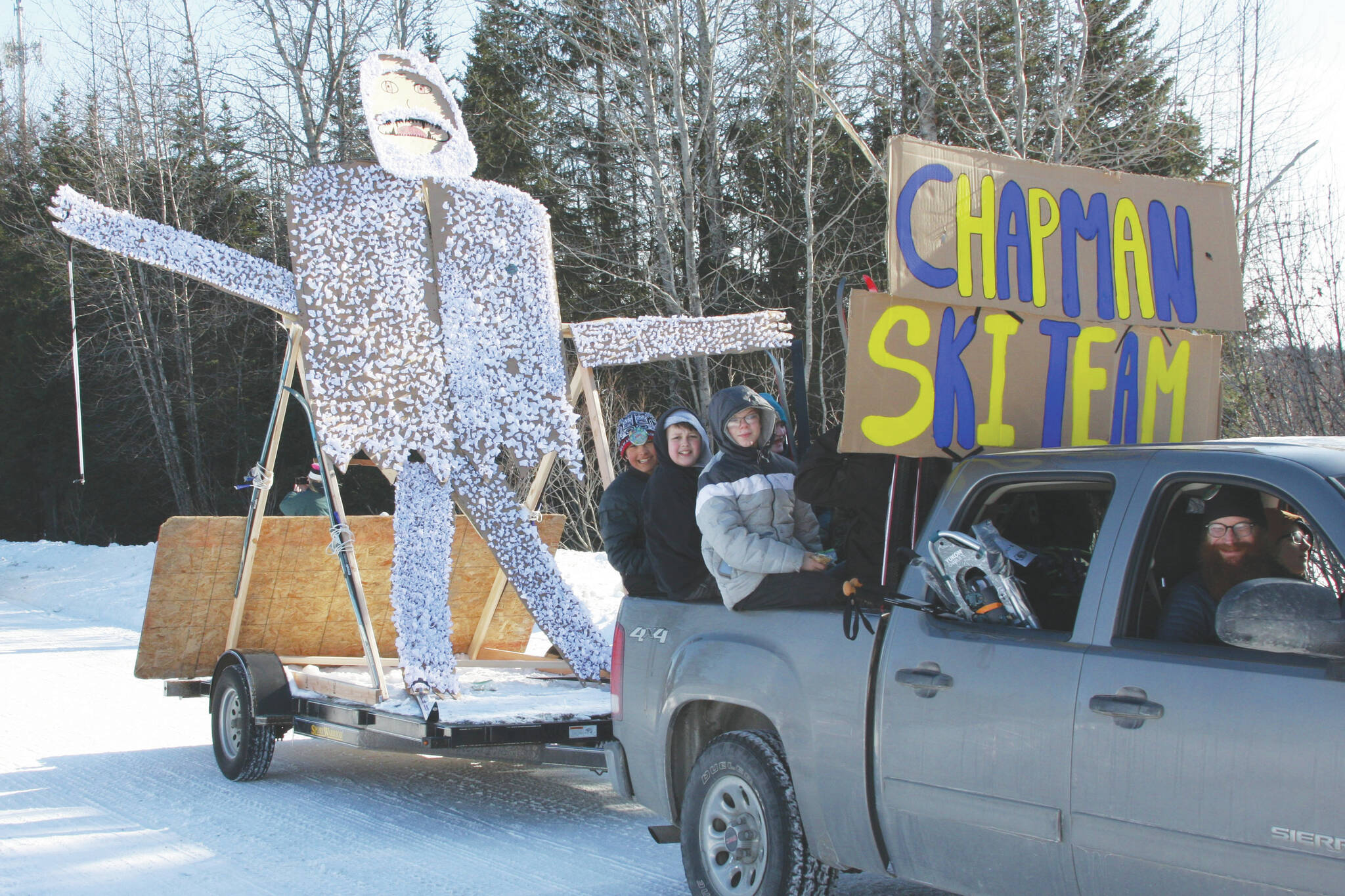 The Chapman ski team’s float proceeds down School Street during the Snow Rondi Parade on Saturday in Anchor Point. (Photo by Delcenia Cosman/Homer News)