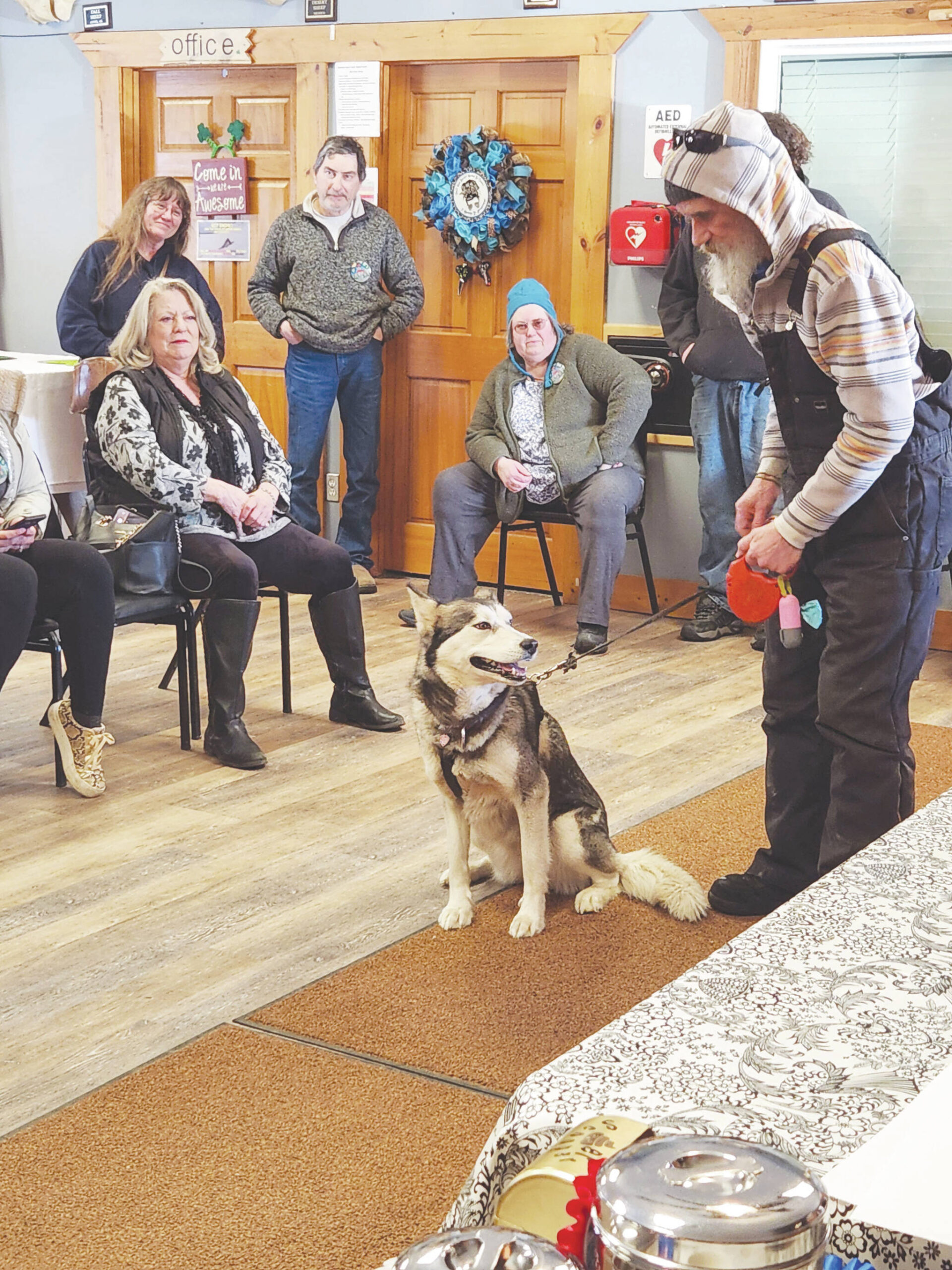 Photo courtesy of Debbie Carpenter
Allen Rasmussen shows his husky, Ayla, to the audience of the Snow Rondi dog show on Sunday at the Anchor Point Senior Center. Ayla won an award for being the “dog that looks most like their owner.”