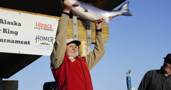 The 28th annual Homer Winter King Salmon Tournament winner Weston Marley holds up the 27.38-pound winter king salmon he caught on Sunday, April 10, 2022, in Kachemak Bay, Homer, Alaska. (Photo by Michael Armstrong/Homer News)