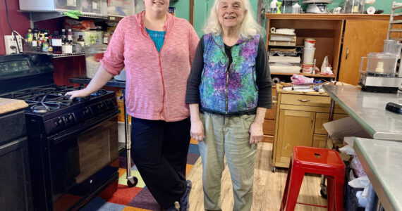 Anna Wall and Sheryl Vitale, daughter-mother duo behind Red Bird Kitchen, stand in their kitchen on East End Road, photo taken March 13, 2023, in Homer, Alaska. (Photo by Christina Whiting/Homr News)