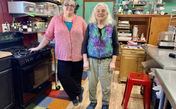 Anna Wall and Sheryl Vitale, daughter-mother duo behind Red Bird Kitchen, stand in their kitchen on East End Road, photo taken March 13, 2023, in Homer, Alaska. (Photo by Christina Whiting/Homr News)