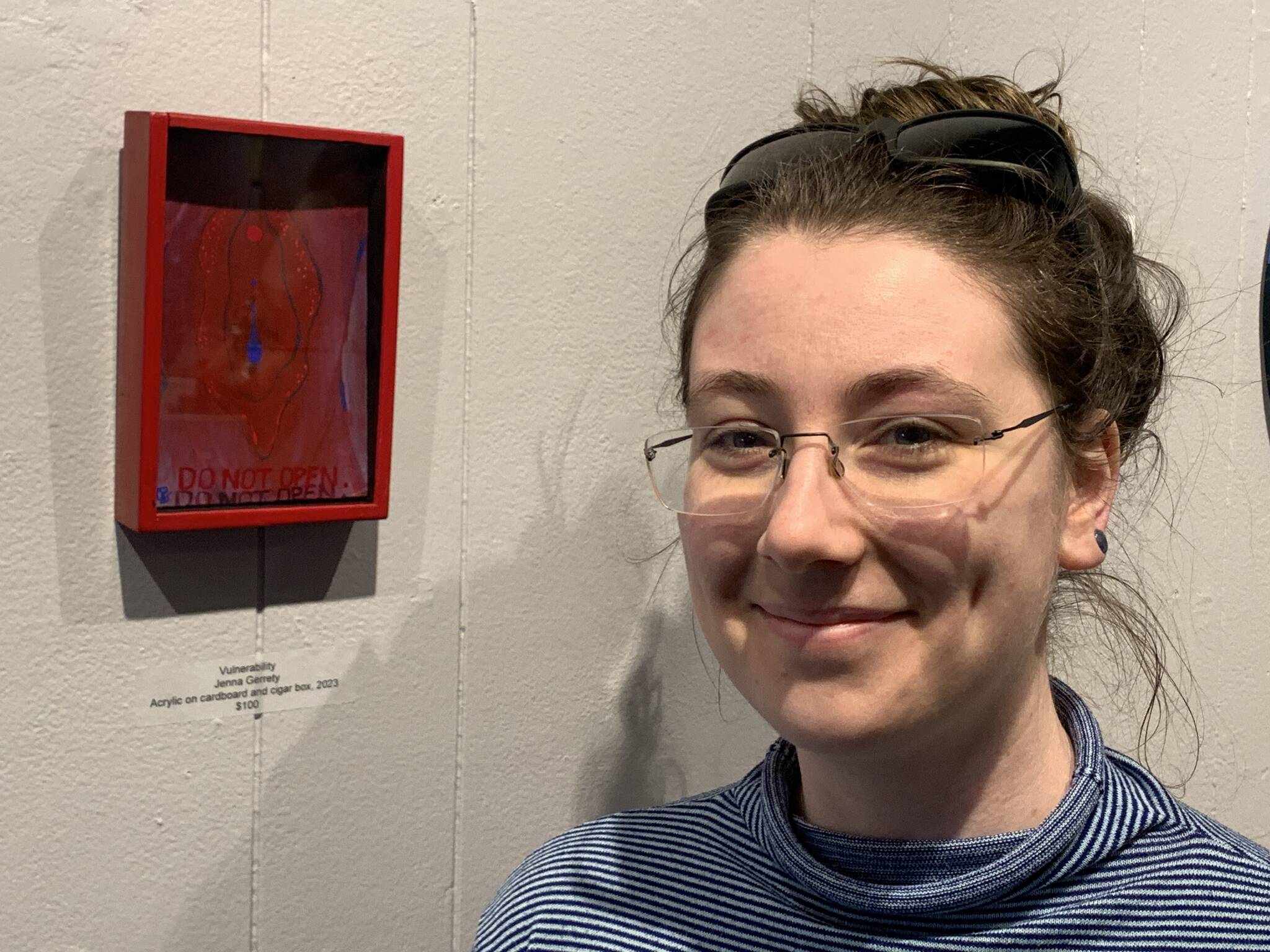 Photos by Christina Whiting/Homer News
Artist Jenna Gerrety poses with her piece “Vulnerability,” acrylic on cardboard and a cigar box, on display at Homer Council on the Arts through March as part of the “Bodily Autonomy” exhibit co-sponsored by Kachemak Bay Family Planning Clinic.