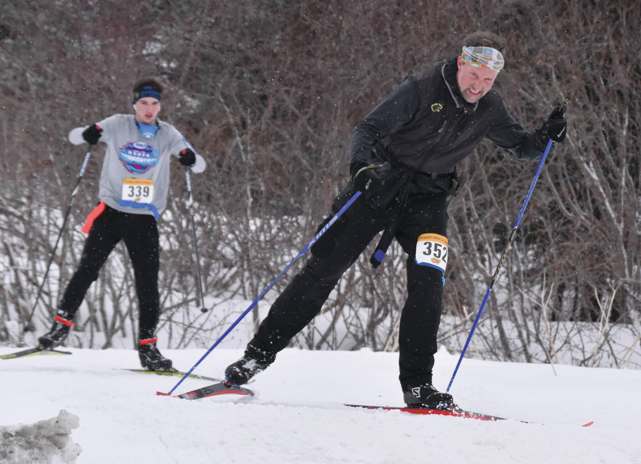 Homer’s Scott Hauser leads Homer’s Leif Jaworski up a hill in the 25-kilometer men’s race at the Kachemak Nordic Ski Marathon outside of Homer, Alaska, on Saturday, March 18, 2023.