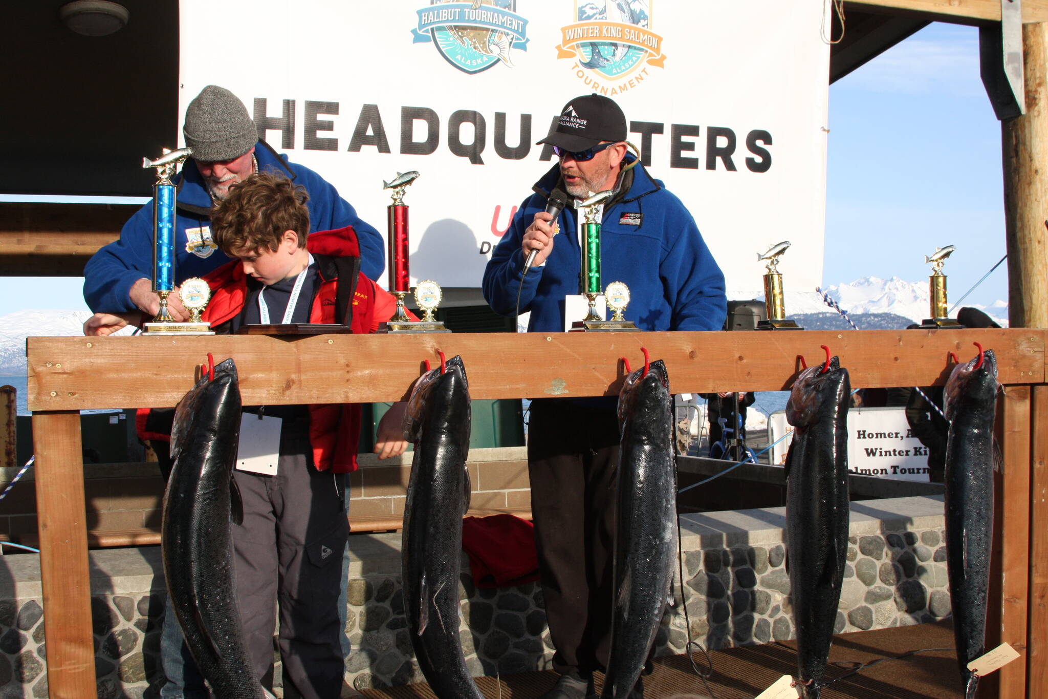 Top youth angler, nine year old Liam Carney, puts on his winner’s vest during the Homer Winter King Salmon Tournament awards ceremony on Saturday. Photo by Delcenia Cosman