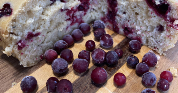 White chocolate cranberry cake is served with fresh cranberries. (Photo by Tressa Dale/Peninsula Clarion)